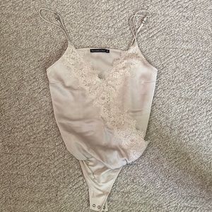 ABERCROMBIE AND FITCH size small champagne bodysuit